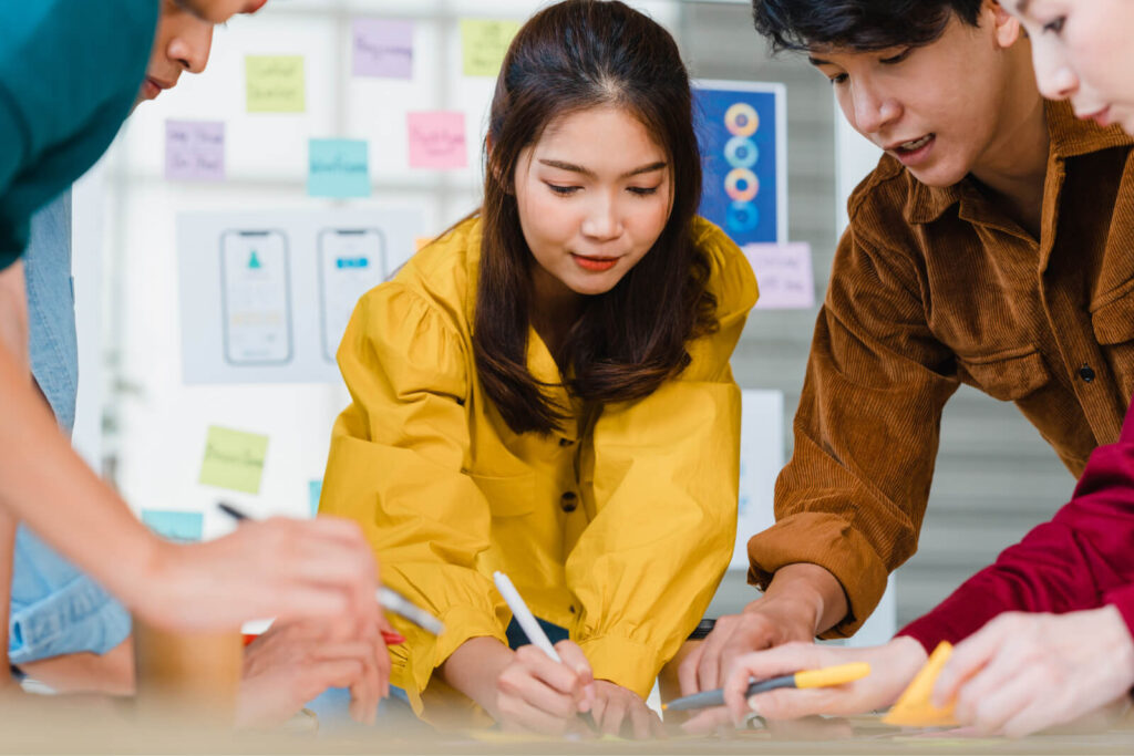 Asian Business Men and Business Women Meeting Brains