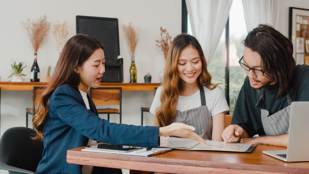 Asian Small Business Owners Couple Meeting